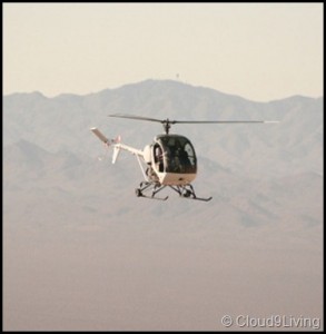 felicopter flying in front of mountains