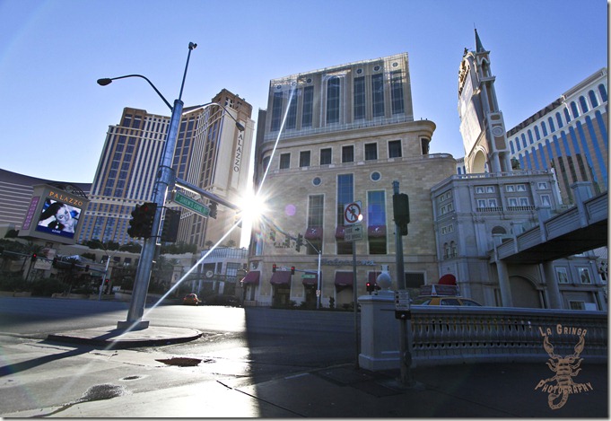 sun rising between the buildings at the Palazzo casino - Las Vegas