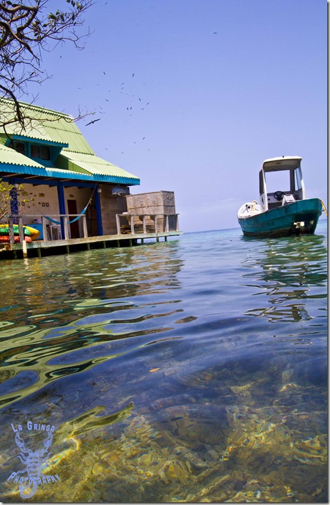 Isla de Rosario, Cartagena, Colombia, island house and boat in Caribbean water, GoingNomadic, La Gringa Photos, Dani Blanchette