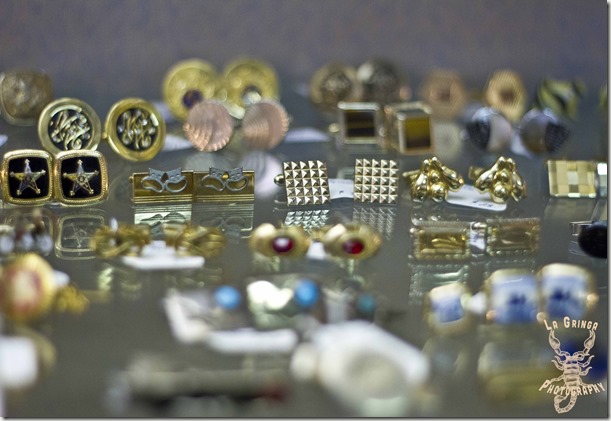 fancy cufflinks on display table, assorted cufflinks, vintage jewelry