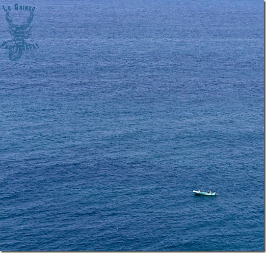 boat in water, tiny boat in large ocean, blue water, blue, just ocean, ecuador, manta, south america